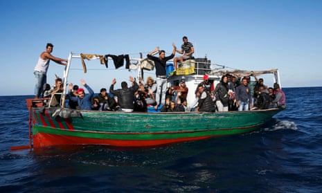 A boatload of migrants making the crossing from Tunisia to Sicily