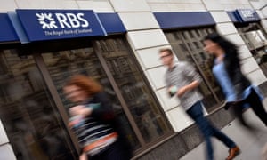 People walking past an RBS branch.