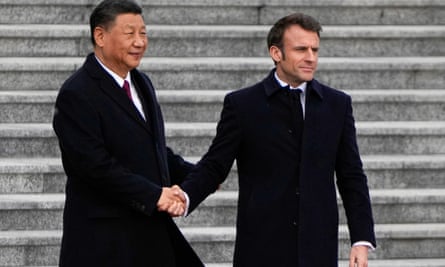 The Chinese president, Xi Jinping, left, shakes hands with Emmanuel Macron during a state visit by the French president.