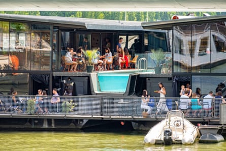 floating bar on large moored vessel in river