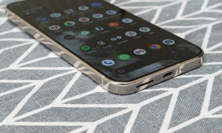 A Google Pixel 9 Pro XL laying face up on a tablecloth.