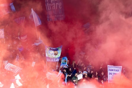 Spal supporters cavort amid red smoke from flares during a Serie B match against Como in 2023.