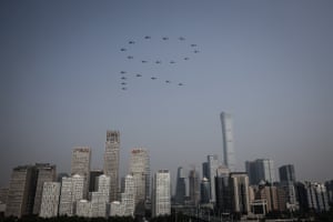 Planes from the Chinese People’s Liberation Army (PLA) air force fly in formation during a massive parade to celebrate the 70th anniversary of the founding of the People’s Republic of China