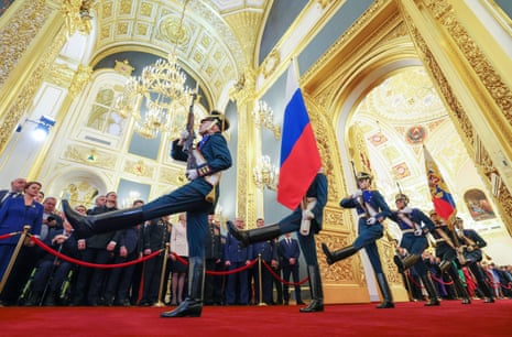 Soldiers of the Presidential Regiment bring in the national flag during the inauguration ceremony of Vladimir Putin as Russian President in the Kremlin, Moscow, Russia.