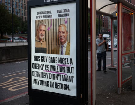 A poster on a bus stop shows Nigel Farage and Christopher Harborne with the words: ‘This guy gave Nigel a cheeky £5 million but definitely doesn’t want anything in return.’