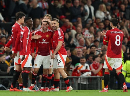 Mason Mount celebrates with teammates after scoring Manchester United’s fourth goal and his second.