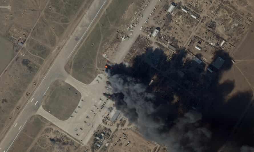 A satellite picture shows smoke rising from Kherson airport and airbase after a suspected Ukrainian strike damaged Russian helicopters and vehicles.