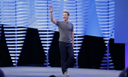 Mark Zuckerberg waves while walking on stage to deliver the keynote address at Facebook’s F8 conference.
