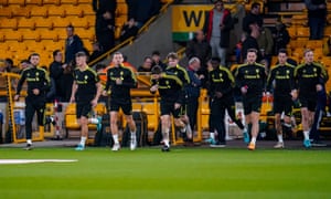 Leeds United midfielder Kalvin Phillips (23) and teammates warming up during the Premier League match between Wolverhampton Wanderers and Leeds United at Molineux.