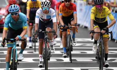 Adam Yates crosses the finish line for stage eight in Loudenvielle with Egan Bernal