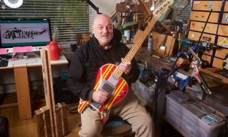 Paul Edwards at home in Salford with a guitar he built.