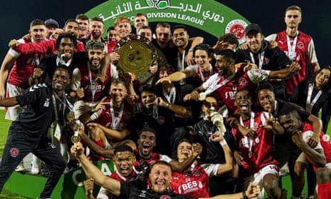 Fleetwood United players and staff celebrate on 6 April 2024 after winning the United Arab Emirates second division