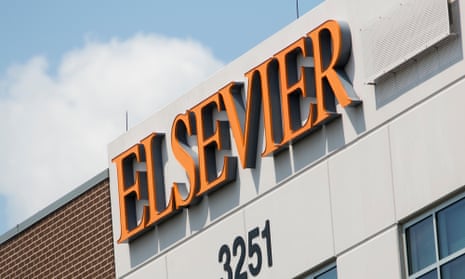An orange Elsevier logo sign is seen on a brick and stone building the company occupies in Missouri.