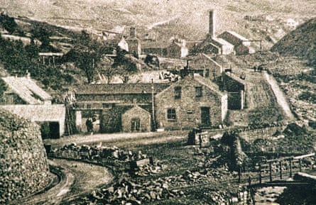 A monochrome photo of chimneys and mine buildings
