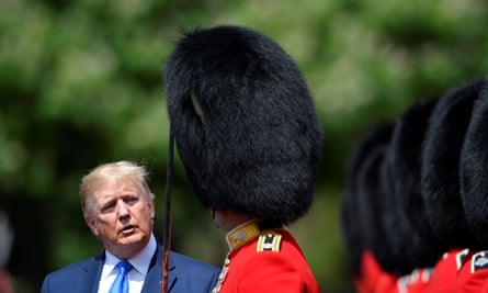 Donald Trump inspects an honour guard at Buckingham Palace.