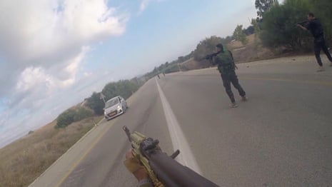 Newly released footage shows Hamas fighters shooting at vehicles – video