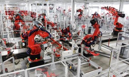 Robots assembly a Tesla Model S at the firm’s factory in Fremont, California