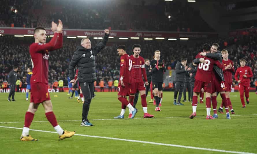 Neil Critchley celebrates at Anfield with his young Liverpool side after the 1-0 FA Cup fourth-round replay win against Shrewsbury in February.