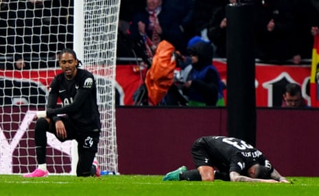 Tottenham Hotspur's Pedro Porro (right) and teammate Djed Spence (left) dejected after conceding their fifth goal.