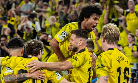 Niclas Füllkrug is congratulated by his Borussia Dortmund teammates after his goal.