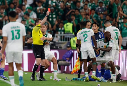 Al-Ahli’s Zakaria Hawsawi is shown a red card by Ilgiz Tantashev.