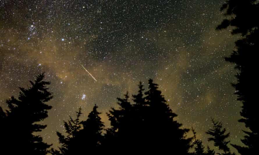 A meteor streaks across the sky during the annual Perseid meteor shower in August 2021.