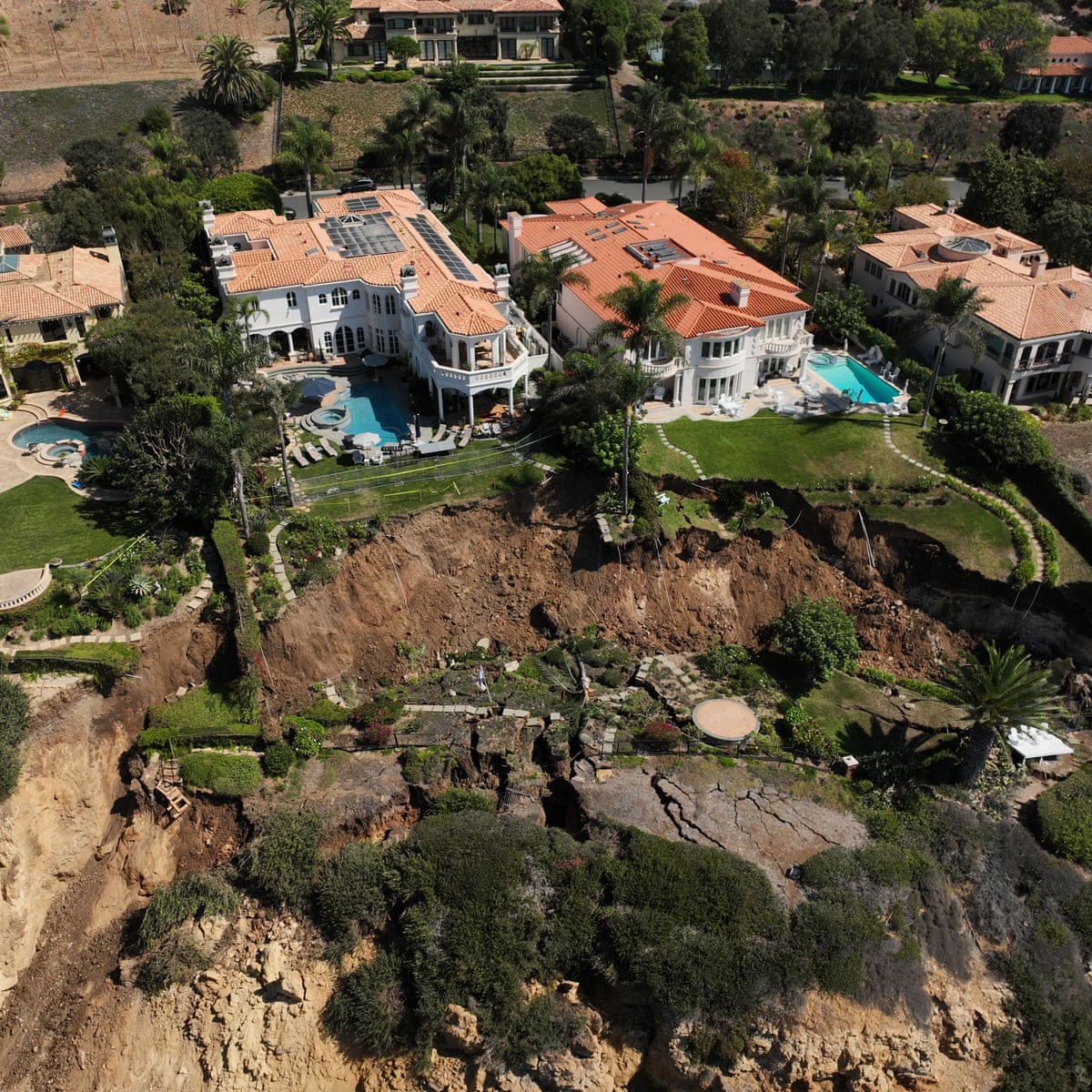 Photos show bluff crumbling towards ocean in landslide-stricken California enclave | California | The Guardian