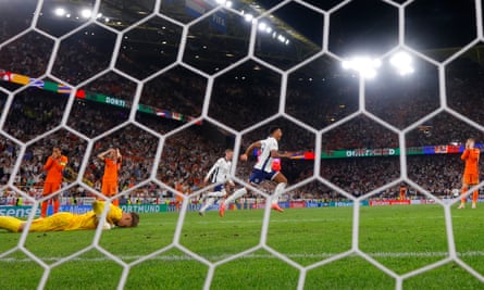 Ollie Watkins (centre) celebrates after scoring his team's second goal past Netherlands' goalkeeper Bart Verbruggen (left) during the Euro 2024 semi-final match between Netherlands and England.