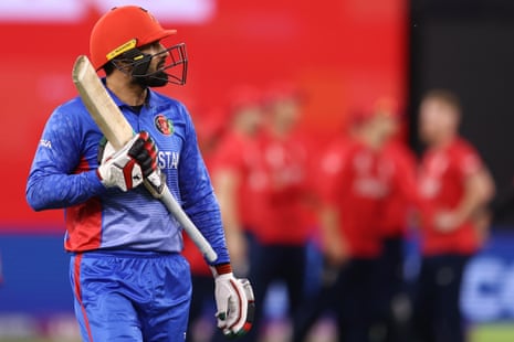 Mohammad Nabi of Afghanistan walks from the field after being dismissed Mark Wood of England.
