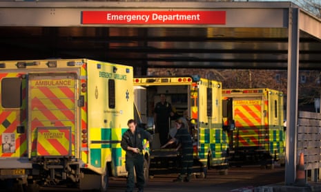 A patient is taken from an ambulance parked outside Gloucestershire Royal Hospital