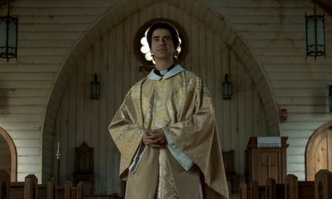 Hamish Linklater as the young Father Paul, in a church, in Midnight Mass