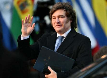 The president waves as he arrives at a summit for a group of South American countries.