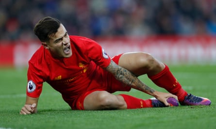 Philippe Coutinho reacts after sustaining his injury.