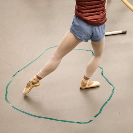 Students from the New National Theatre Ballet School take part in a daily ballet class