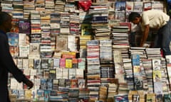 Book seller arranges his street book stall for customers in Mumbai