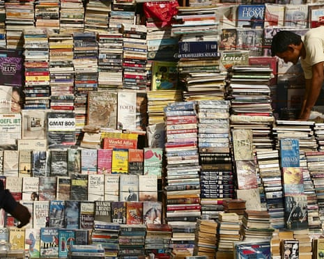 Book seller arranges his street book stall for customers in Mumbai