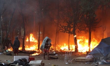 Shacks burn during this summer’s police operation against Crackland.