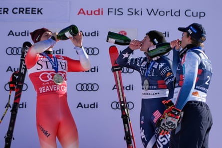 Switzerland's Marco Odermatt, left, celebrates with second-place finisher Ryan Cochran-Siegle, center, and third-place finisher Adrian Smiseth Sejersted after Thursday’s downhill.