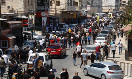 Crowds in Jenin for the funeral of two of those killed in the Israeli raid