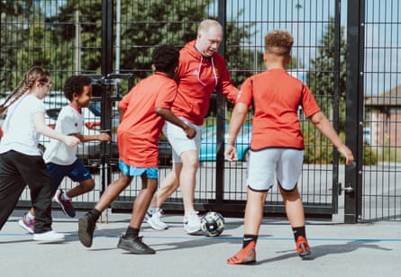 Paul Scholes playing football with children at a special free school in Stretford, Greater Manchester