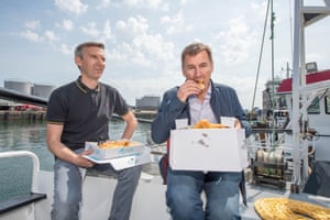 Jeremy Hunt (right) has some fish and chips with skipper James West on board of West’s boat