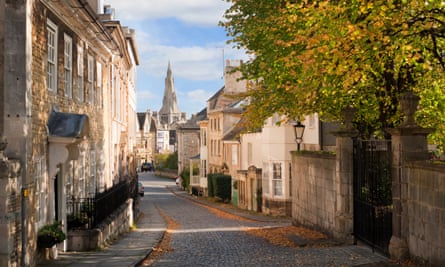 View down Barn Hill, Stamford with golden-stone buildings.