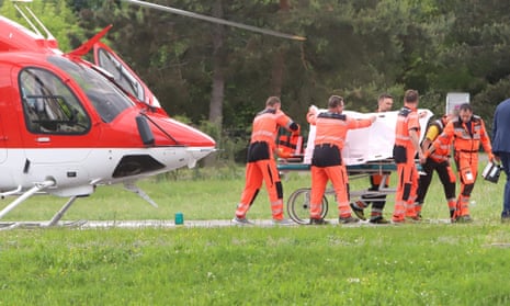 Rescuers transfer wounded Slovak PM Robert Fico from a helicopter to a hospital