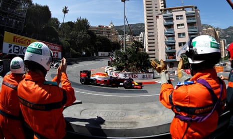 Marshals applaud Daniel Ricciardo on his slowdown lap after he claimed pole position for Red Bull in qualifying for the Monaco F1 Grand Prix
