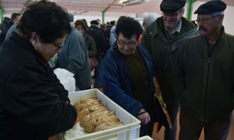 People buy foie gras in a market in Samatan, south-western France.