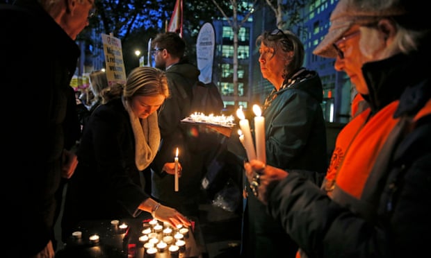 People attend a vigil outside the Home Office in Westminster for the 39 Chinese people found dead inside a lorry.