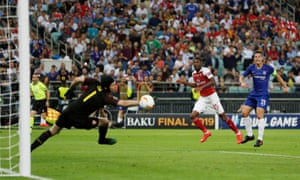 Chelsea’s Cesar Azpilicueta shoots at goal as Arsenal’s Petr Cech attempts to save and Ainsley Maitland-Niles looks on.