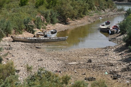 Fishing boats in a depleted river in the Huwaiza marshes, near Amarah, on the Iraq-Iran border.