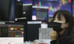 A currency trader wearing a mask