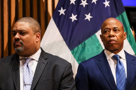 Two men stand at a press conference